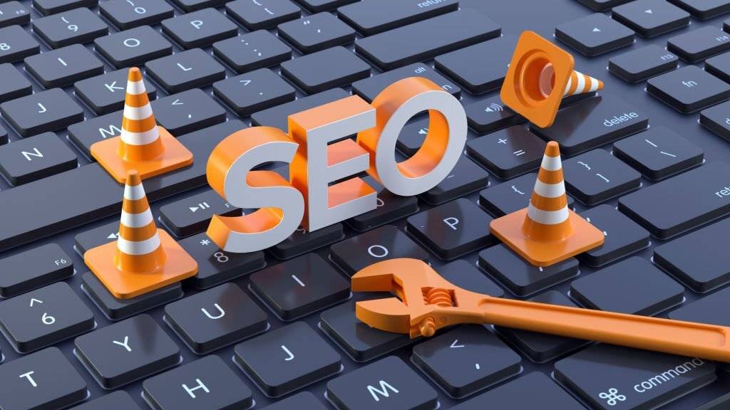 3D SEO Lettering With Traffic Cone and Wrench on Computer Keyboard